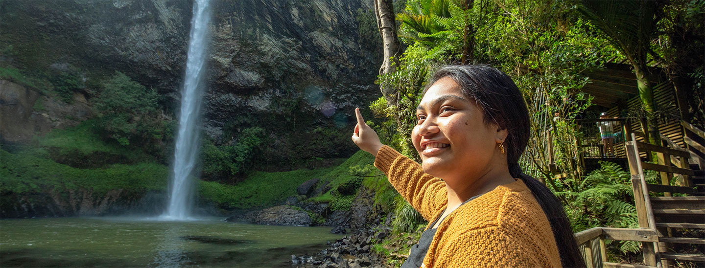 Female student outside waterfall