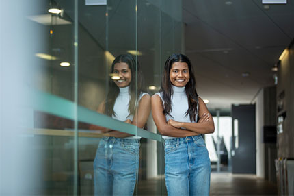 Female student standing alone happy