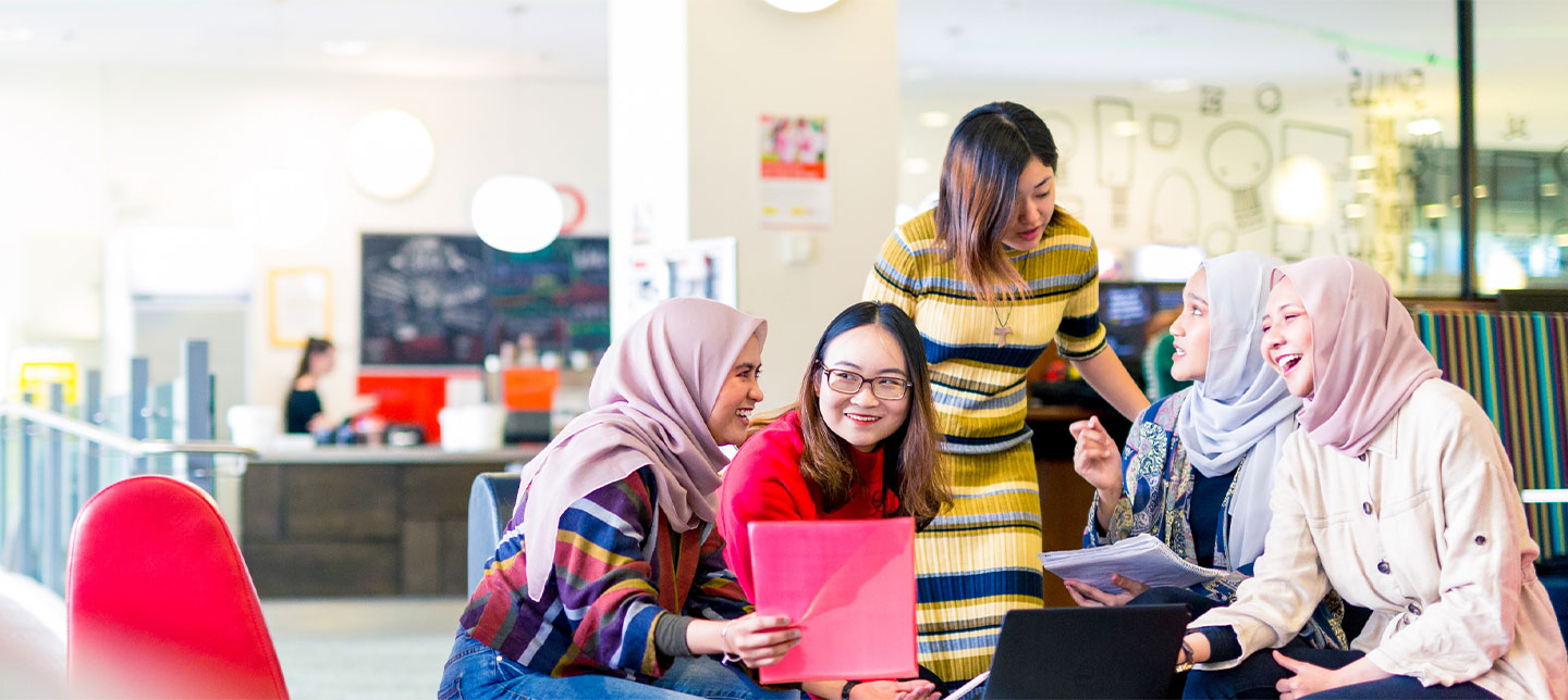 Students in class working together socialising